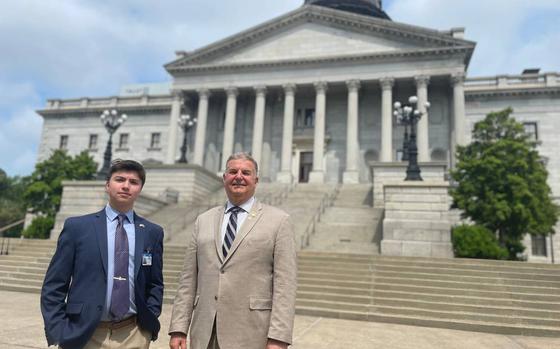 Elias Irizarry and state Rep. David ONeal pictured outside the State House in Columbia, S.C., on April 6, 2023.