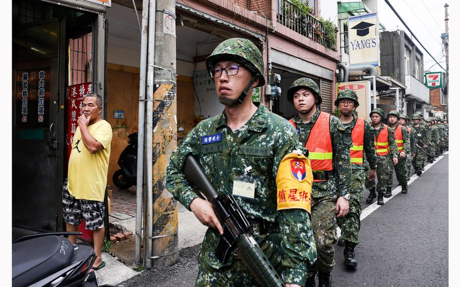 Soldiers march along a street during the Han Kuang military exercise in Taoyuan, Taiwan, on July 26, 2023.