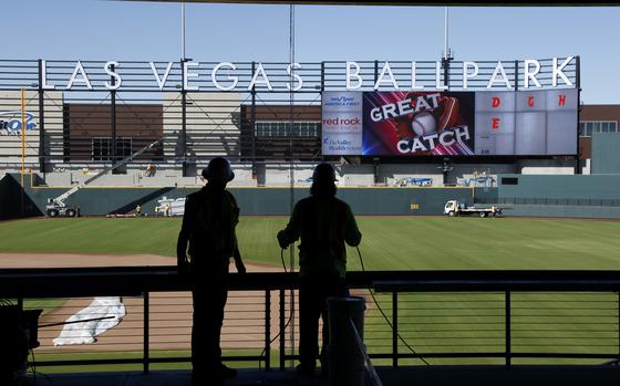 FILE - Workers continue construction on a new baseball park in Las Vegas, March 28, 2019. Major League Baseball team owners are set to vote Thursday, Nov. 16, 2023, on the proposed relocation of the Oakland Athletics to Las Vegas at the end of their league-wide meeting. (AP Photo/John Locher, File)