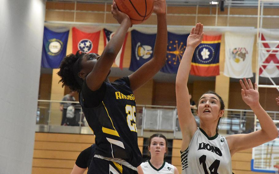 Ansbach’s Elizabeth Agudzi-Addo shoots before AFNORTH defender Maggie Masse can get there Thursday, Feb. 15, 2024, at the DODEA European Division III Basketball Championships in Wiesbaden, Germany.