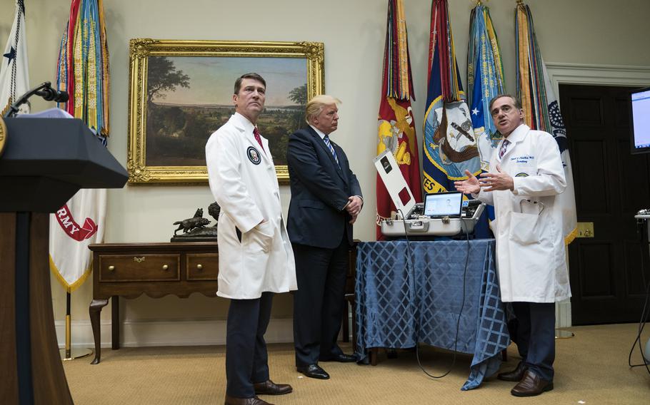 Ronny Jackson, left, then White House physician, and President Donald Trump at the White House in 2017. 