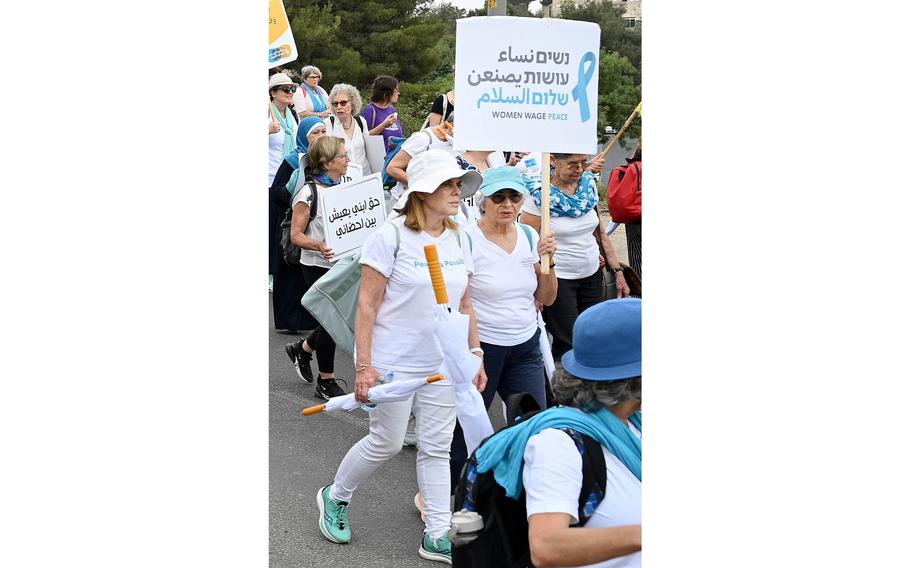 Vivian Silver, center with sign, takes part in a peace march in Jerusalem on Oct. 4, 2023, just days before she was kidnapped.