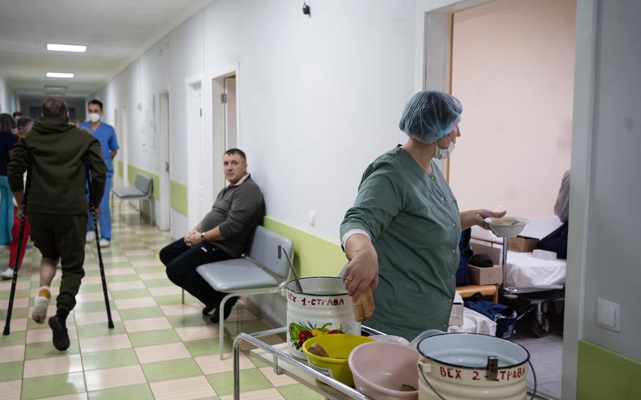 A nurse brings food to Ukrainian soldiers who were released in a prisoner exchange Tuesday.
