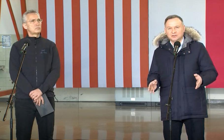 NATO Secretary-General Jens Stoltenberg, left, listens to Polish President Andrzej Duda during a press conference at Lask Air Base, Poland, March 1, 2022. 