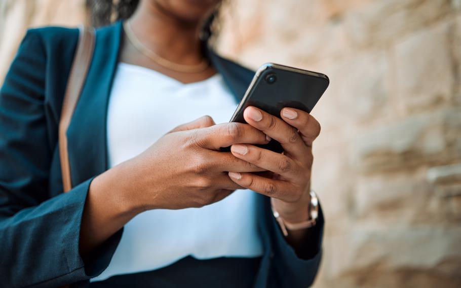 Hands, smartphone and woman typing on cell phone.