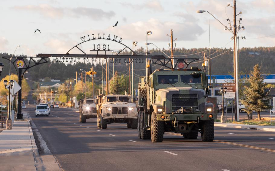 Marines drive down a street in Williams, Ariz., May 15, 2021.  Marines with 2nd Transportation Battalion, Combat Logistics Regiment 2, 2nd Marine Logistics Group crossed the United States in one of the longest convoys in the service's history. 