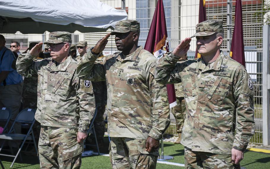 Brig. Gen. Mark Thompson, from left, Lt. Gen. R. Scott Dingle and Brig. Gen. Clinton Murray salute during a change of command ceremony in Landstuhl, Germany, June 1, 2022. Murray took charge of Regional Health Command-Europe from Thompson with Dingle, the surgeon general of the U.S. Army, officiating. 