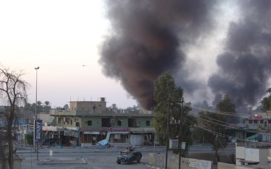 A building in Bayji’s business district burns during the Nov. 14, 2004, firefight between soldiers from Task Force 1-7 and Iraqi insurgents in the key northern crossroads that is a center of oil and power production. It had been the scene of heavy rebel activity since Nov. 9.
