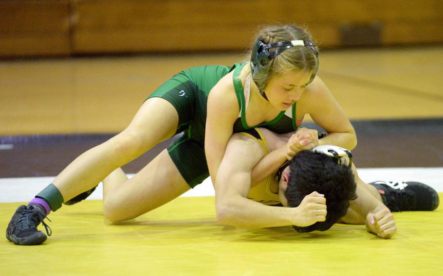 Kubasaki 107-pounder Billi Readinger gains the upper hand on Kadena's Takuma Stofer during Wednesday's Okinawa wrestling regular-season finale. Readinger pinned Stofer in 5 minutes, 7 seconds, but the Panthers won the meet 34-28, completing a six-meet regular-season sweep of the Dragons.