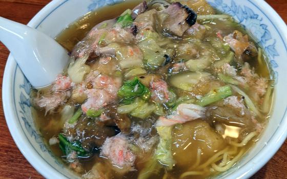 The hearty gomoku umani soba from Fukusei, near Yokosuka Naval Base, Japan, features vegetables, fried pork, shrimp and crab meat in a Chinese sauce.