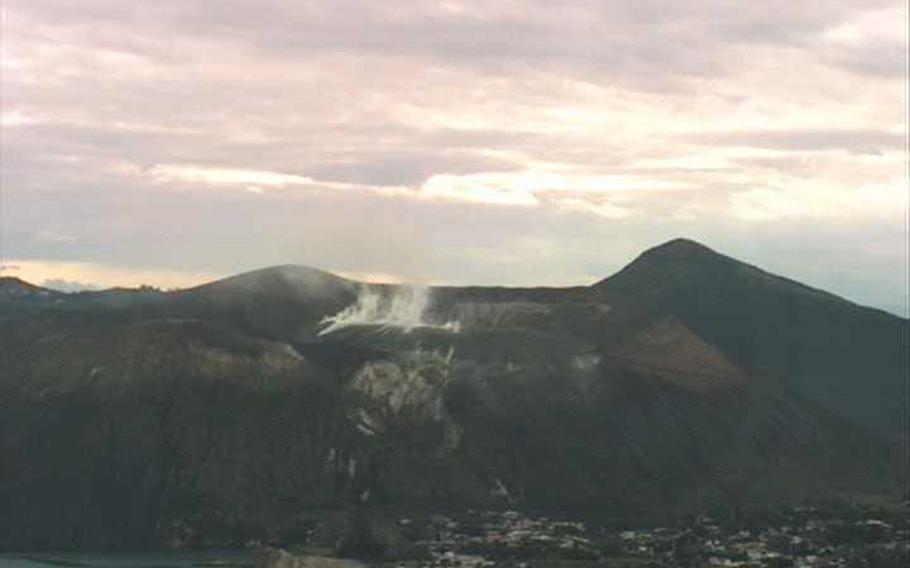 A webcam image shows smoke rising from an active volcano on the island of Vulcano in Italy, Nov. 23, 2021. 