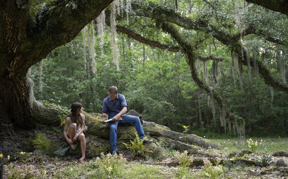 This image released by Columbia Pictures shows Daisy Edgar-Jones, left, and Taylor John Smith in a scene from "Where the Crawdads Sing."  