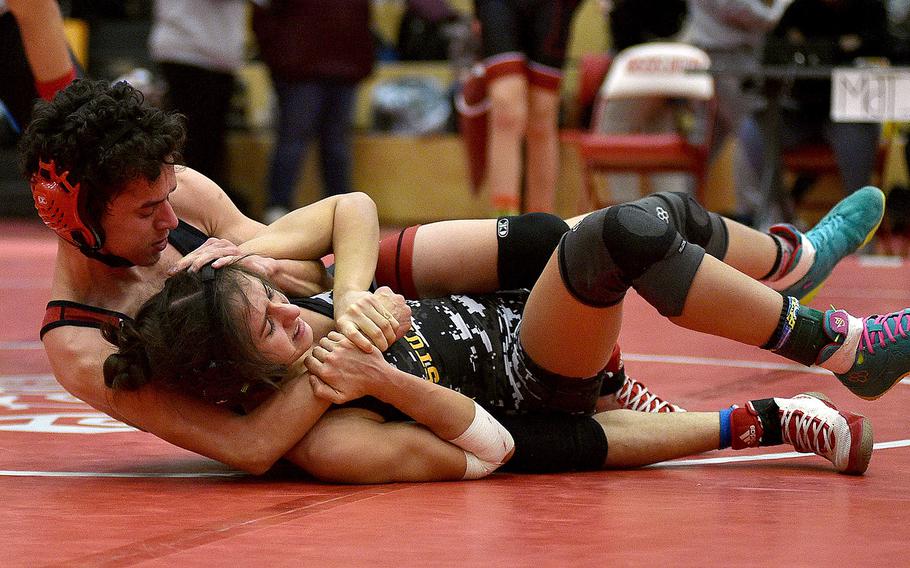 Kaiserslautern's Jaden Calixto puts Stuttgart's Karmyn Lopez in a lock during the 106-pound final at a wrestling meet on Jan. 27, 2024, at Kaiserslautern High School in Kaiserslautern, Germany.