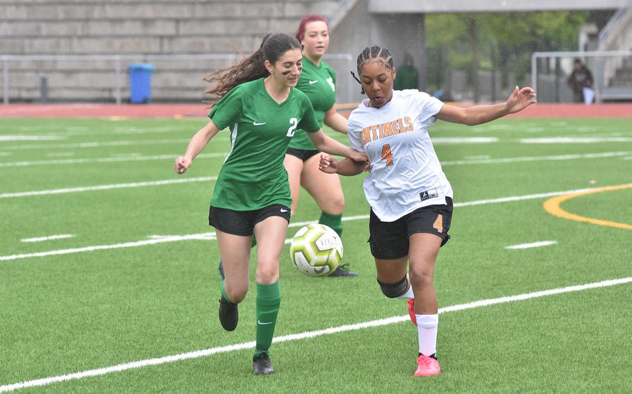 Alconbury's Kylie Leach and Spangdahlem's Aniya Robinson battle for the ball Tuesday, May 16, 2023, in the Dragons' 4-1 victory over the Sentinels in the second day of the DODEA-Europe girls Division III championships at Ramstein Air Base, Germany.