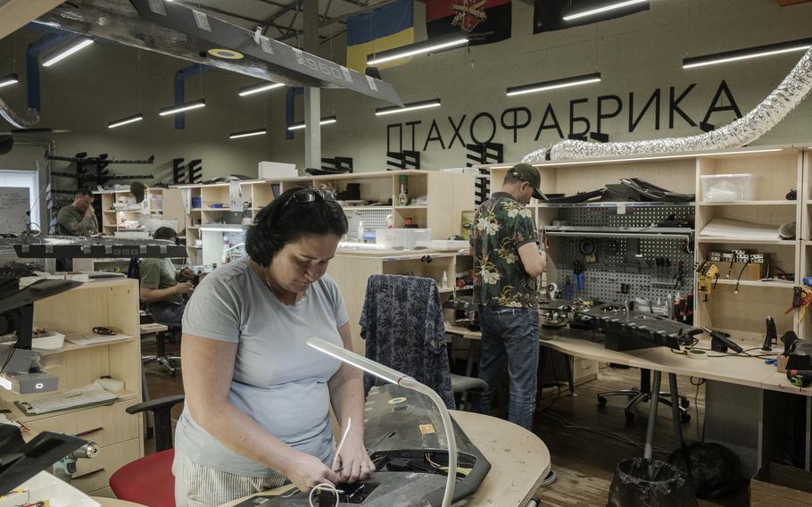 Oksana Romanenko works on a drone at the Warbirds of Ukraine production facility. 