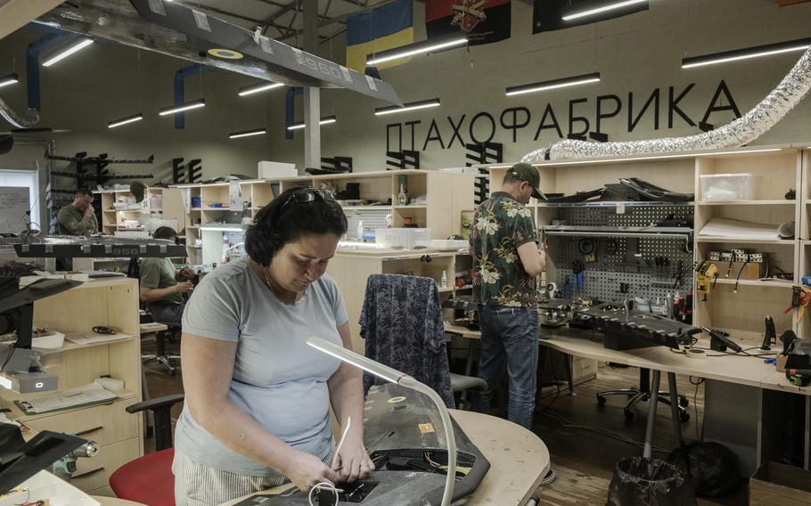 Oksana Romanenko works on a drone at the Warbirds of Ukraine production facility. 