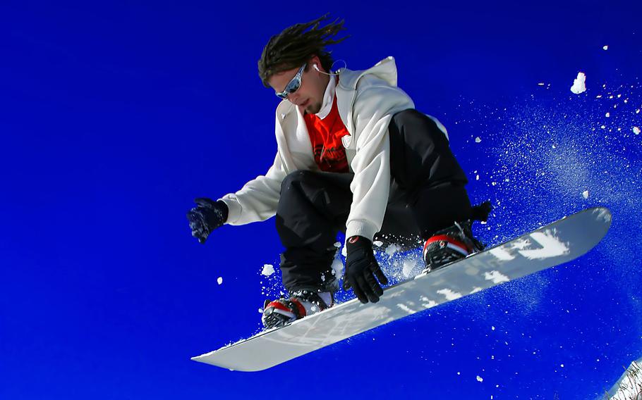 A snowboarder in the Colorado mountains. Not all ski resorts in Colorado are suitable for amateurs. 