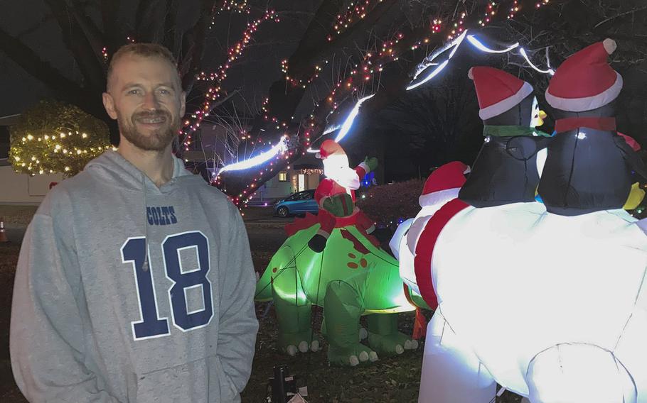 U.S. Air Force Tech. Sgt. Sgt Brandon Newman, shown here Dec. 7, 2022, decorates his family's home at Yokota Air Base in western Tokyo every Christmas season. 