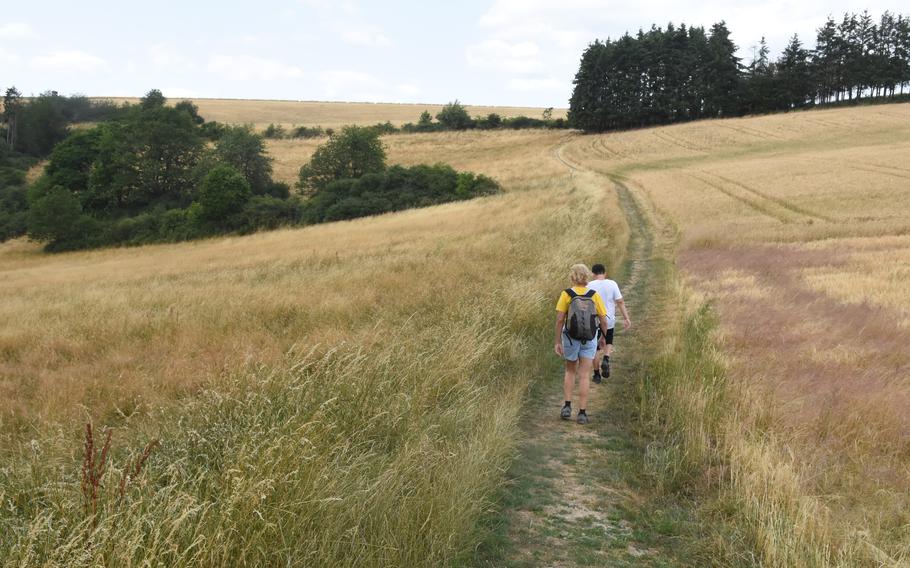 Hikers cross an open field along the Path of the Middle Ages, a 5.2-mile loop that starts in the town of Herrstein, Germany, north of the U.S. Army’s Baumholder post.