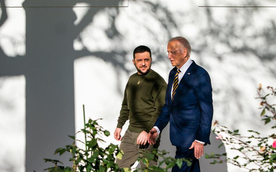 President Biden and Ukrainian President Volodymyr Zelensky walk to the Oval Office on Wednesday. The omnibus includes about $44.9 billion for Ukraine. 