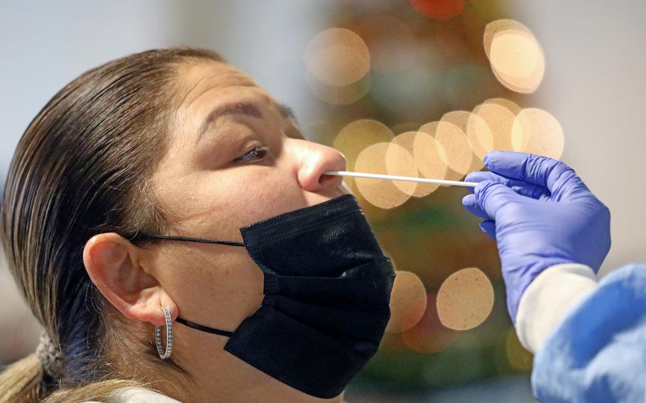 Marlene Alvarez receives a rapid PCR COVID-19 test at the South Central Family Health Center on Wednesday, Dec. 29, 2021 in Los Angeles. Researchers are working on a COVID-19 test that could deliver results in 30 seconds.