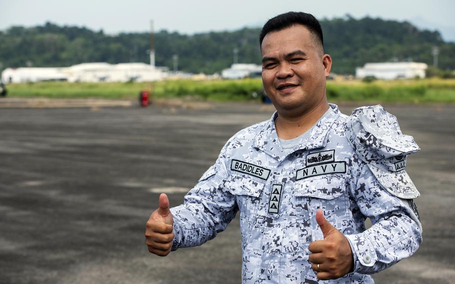 Philippine navy Lt. Giovani Badidles poses on the airfield during a Balikatan drill at the former home of Naval Air Station Cubi Point, Sunday, April 23, 2023. 