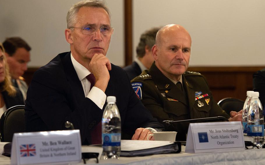NATO Secretary-General Jens Stoltenberg and U.S. Army Gen. Christopher Cavoli, who serves as the commander of U.S. European Command and NATO supreme allied commander, listen to a video message from Ukrainian president Volodymyr Zelenskyy during the Ukraine Defense Contact Group meeting on Friday, Jan. 20, 2023, at Ramstein Air Base, Germany.