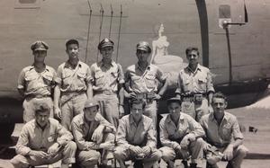 Crew of the “Heaven Can Wait” bomber in Papua New Guinea. 2nd Lt. Thomas V. Kelly Jr. is the middle figure in the back row, standing with his .45 pistol in a shoulder holster. MUST CREDIT: Courtesy of Scott Althaus