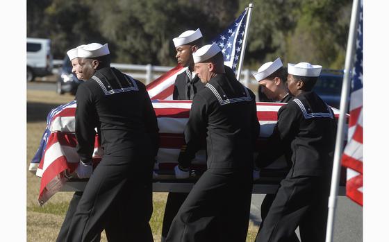 Sailors carry the casket of Cameron Walters at Oak Hill Cemetery in Richmond Hill, Ga., on Dec. 16, 2019. A Florida judge on April 30, 2024, has dismissed a lawsuit against Saudi Arabia over a 2019 mass shooting at the Pensacola Naval Air Station that killed three US service members and wounded several others.