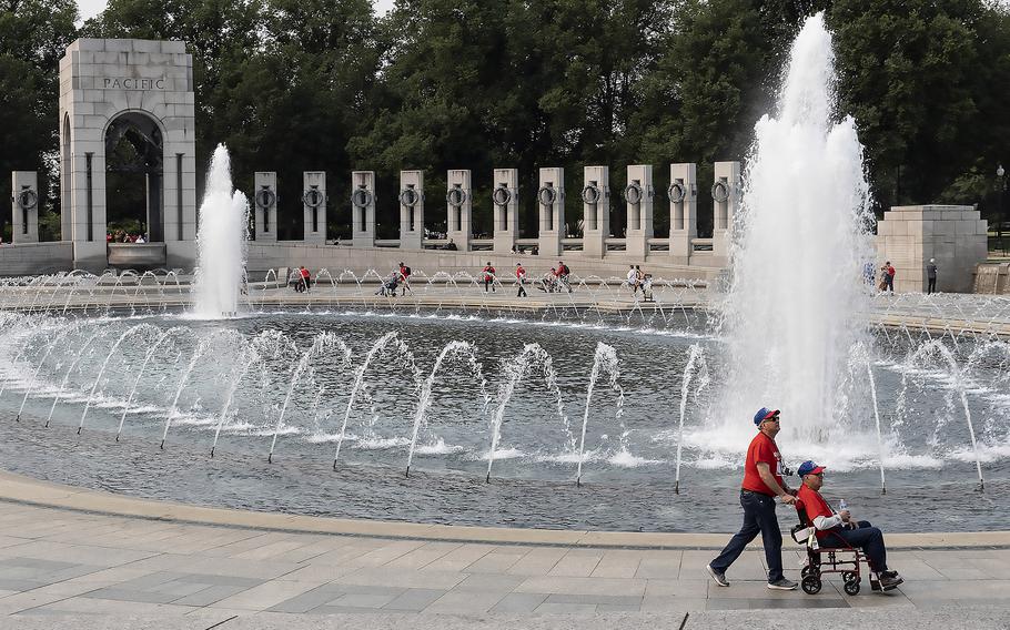 Participants in an Honor Flight from Kansas tour the National World War II Memorial in Washington, D.C., on the 79th anniversary of the start of the D-Day invasion, Tuesday, June 6, 2023.