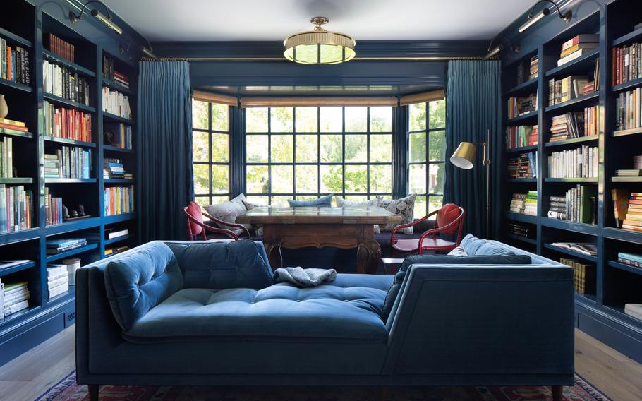 When painting a room a dark shade, designer Ann Lowengart recommends using a high-gloss finish. 