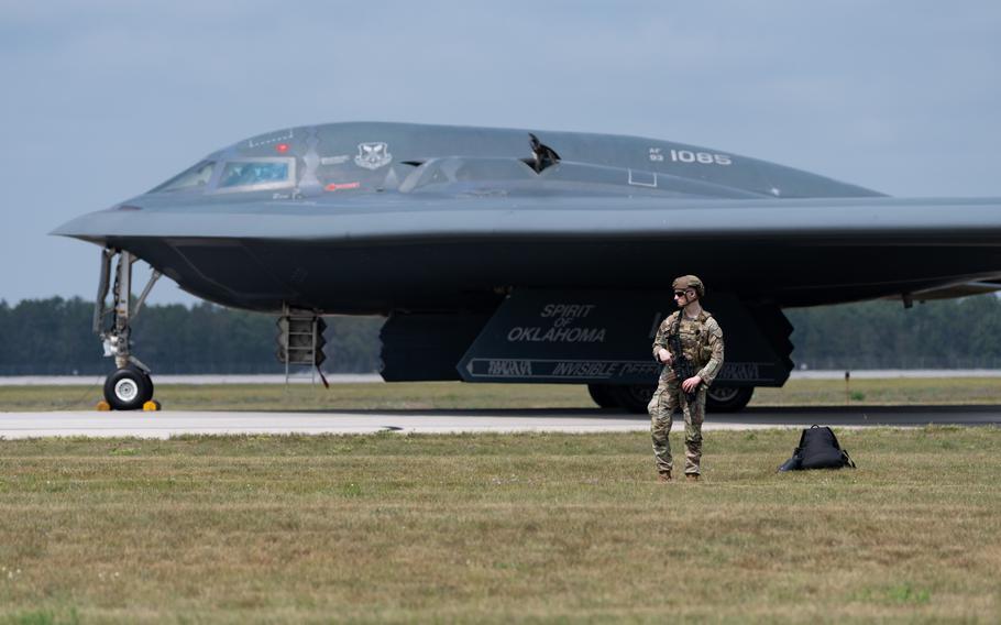 Airman 1st Class Timothy Cadigan, assigned to the 509th Security Forces Squadron out of Whiteman Air Force Base, Mo., guards a B-2 Spirt stealth bomber in Oscoda, Mich., during a rare aircrew changeover outside the aircraft’s home base, Aug. 5, 2025. It was part of the Northern Strike military exercise and marked the first time a B-2, the Air Force’s premier strategic, long-range heavy bomber, landed in Michigan.