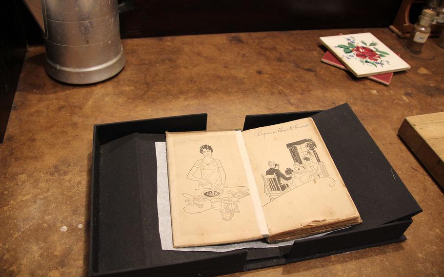 About 90% of the artifacts are original at Andalusia Farm, once home to Flannery O’Connor, the purported queen of Southern Gothic literature. Shown here is the cookbook of Regina Cline O’Connor, Flannery O’Connor’s mother. 