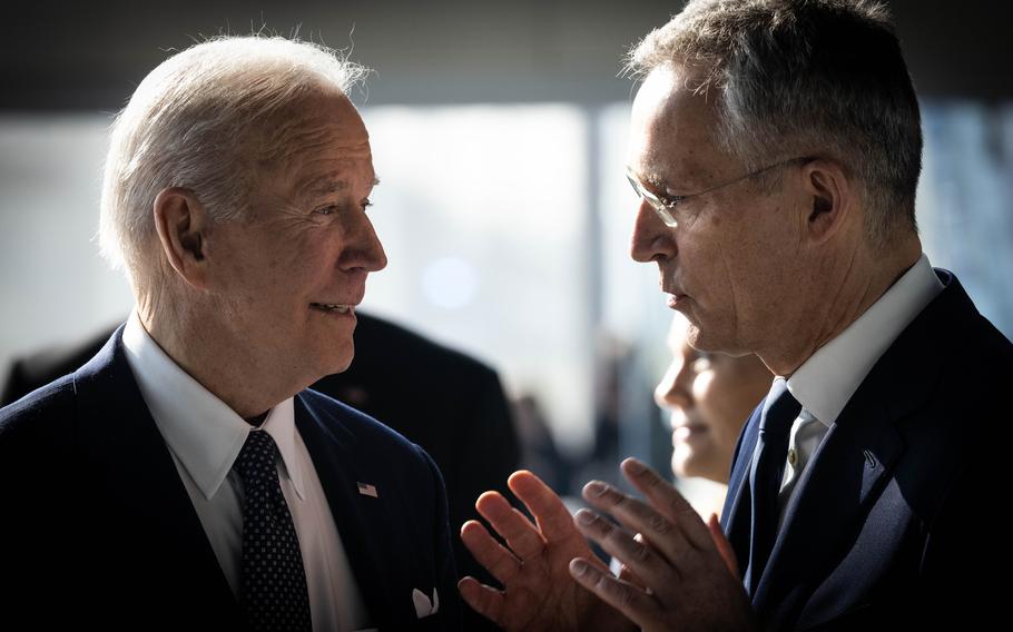 President Joe Biden listens to NATO Secretary-General Jens Stoltenberg before a NATO heads of state summit, March 24, 2022, in Brussels to discuss the Russian invasion of Ukraine.