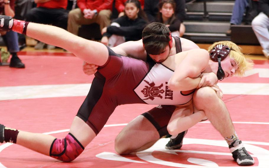 King's Ashton Wall takes charge of Perry's Xander Grantham at 180 pounds.