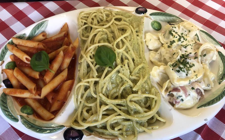 No. 63 on the Da Angelo menu is pasta mista, three types of pasta with three different sauces. The plate consists of rigatoni in tomato sauce, pesto spaghetti and tortellini alla panna, a cream sauce with ham.