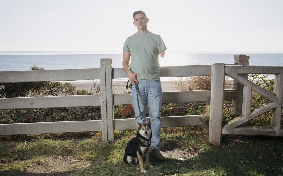 Izzy Ezagui with his dog, Punch, at Palisades Park in Santa Monica, Calif., on Nov. 16, 2023.