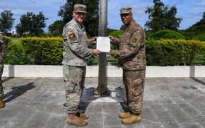 Master Sgt. Bryan Rivera, right, Kadena Air Base protocol non-commissioned officer in charge, was awarded the Air and Space commendation medal for heroism on May 10, 2024, by his commander, Maj. David Loska.