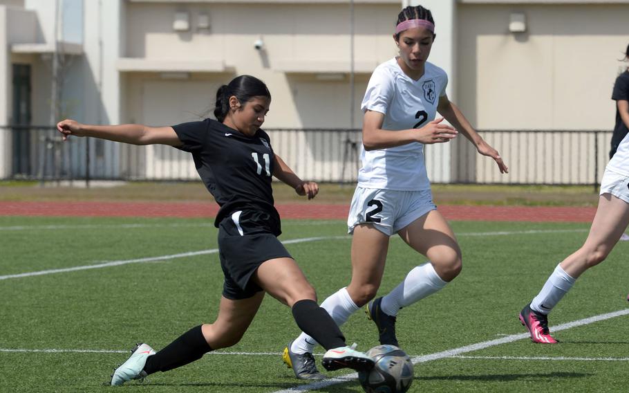 Catalina Feliz kicks the ball.