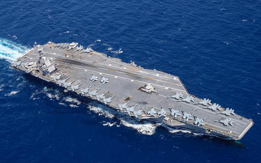Aircraft attached to Carrier Air Wing (CVW) 8 sit on USS Gerald R. Ford’s (CVN 78) flight deck as the ship steams through the Atlantic Ocean, April 13, 2022. The Ford’s first deployment was postponed due to severe weather forecast for Hampton Roads as a nor’easter looms to the south.