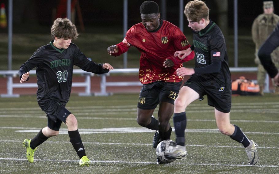 Koboyo Awesso splits two foes.