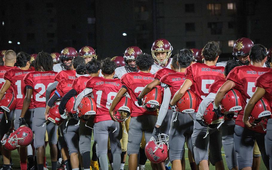 Matthew C. Perry and Nile C. Kinnick football teams congratulate one another after a game on Friday, Sept. 17, 2021.