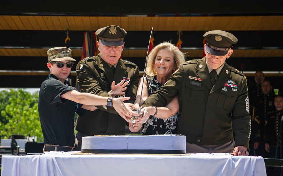 Chief of Staff of the U.S. Army Gen. James C. McConville, second from left, Secretary of the U.S. Army Christine E. Wormuth, center, and Sgt. Maj. of the Army Michael A. Grinston, cut the birthday cake with Miles Avery, left, a Make a Wish recipient, during the Army Birthday Festival Formal Ceremony at the National Museum of the United States Army, Fort Belvoir, Va., June 10, 2023. The event commemorated the 248th Birthday of the U.S. Army.