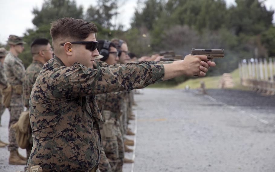 Lance Cpl. Thomas Plowman of the 9th Engineer Support Battalion fires a round during the Far East Marksmanship Competition at Camp Hansen, Okinawa, Dec. 7, 2022.