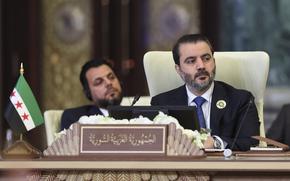 Syrian Foreign Minister Asaad al-Shibani attends the 34th Arab League summit, in Baghdad, Iraq, Saturday, May 17, 2025. (Thaier Al-Sudani/Pool via AP)