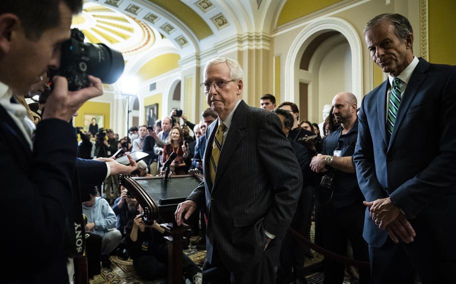 Senate Minority Leader Mitch McConnell (R-Ky.) and Sen. John Thune (R-S.D.) leave a news conference on Capitol Hill in December 2023.