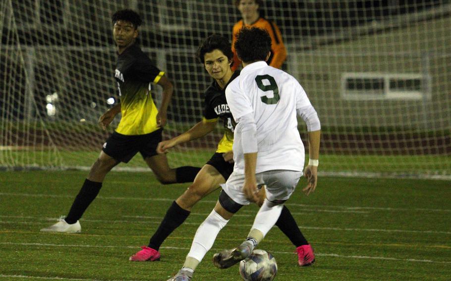 Kubasaki's Matthew Yulee (9) bears down on Kadena's defense during Friday's DODEA-Okinawa soccer match. The Dragons won 2-0.