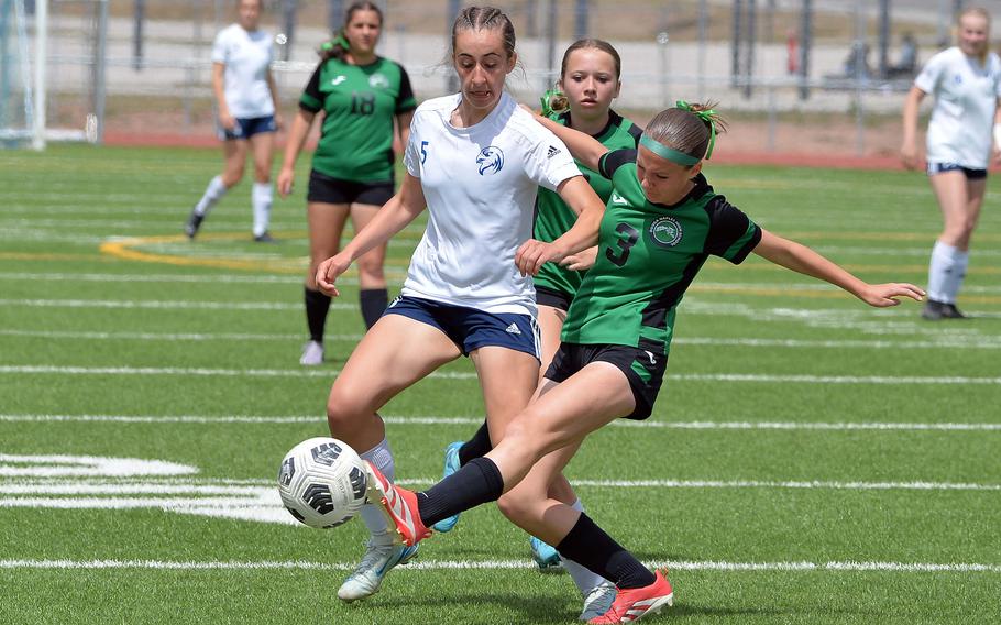 Naples’ Sonja Gottlieb clears the ball against Black Forest Academy’s Micah Gable in the Division II girls final at the DODEA-Europe soccer championships in Ramstein, Germany, May 22, 2025. Naples took the title with a 3-0 win.