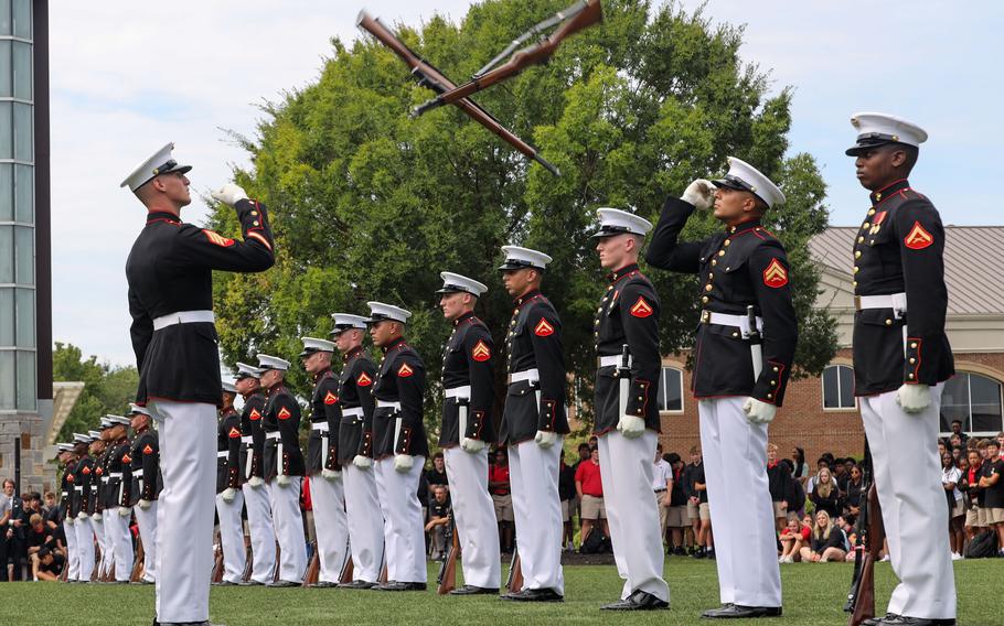 Marine Corps Silent Drill Platoon performs a sequence.