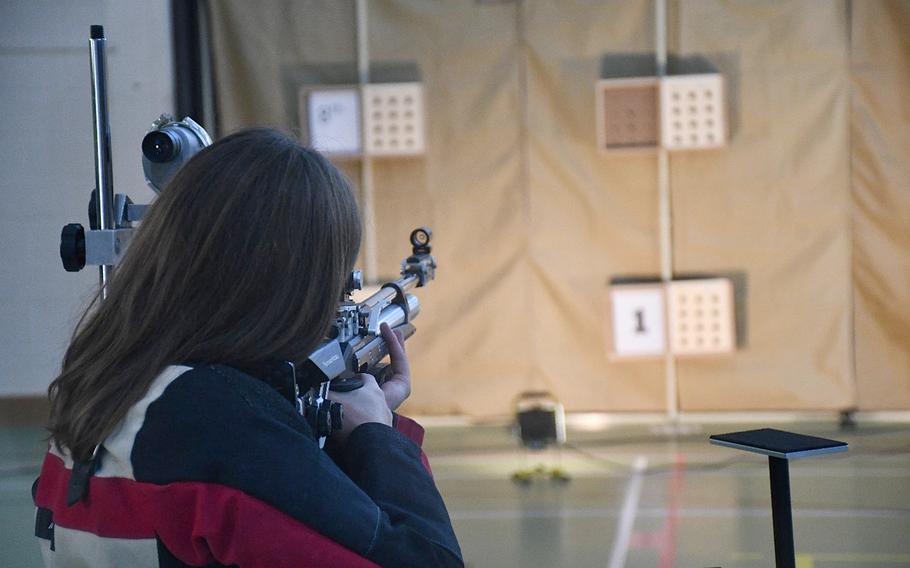 Baumholder’s Ashlyn Brech takes aim during a marksmanship meet Saturday, Dec. 10, 2022, at RAF Alconbury, England. Shooters are scored in three different positions during a record fire: prone, standing and kneeling. 